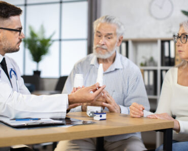 Competent male doctor sitting at desk with various pills in hands while discussing with senior couple way of healthcare treatment. Professional service at medical center. 5 Things to Know About Mesothelioma - https://depositphotos.com/photos/doctor-talking-to-elderly-couple.html?filter=all&qview=510499520