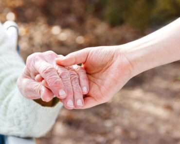 young hand holding a senior persons hand - How ShiftCare is Revolutionizing Home Care in Canada with Smart Software Solutions